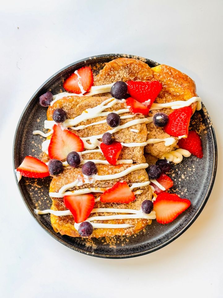 French toast with maple syrup and fresh berries